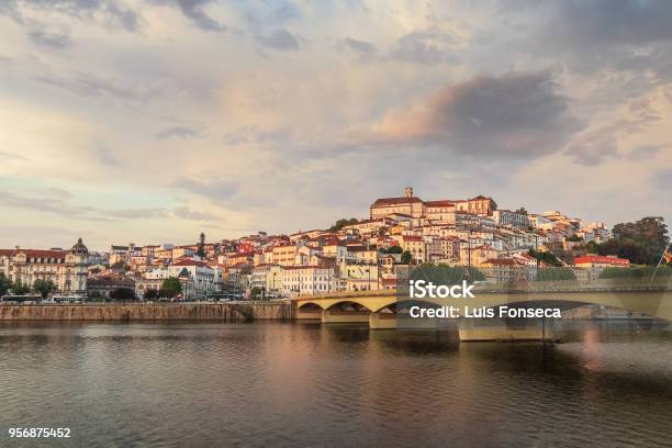 Coimbra At Sunset On A Spring Day With Mondego River And Bridge In Foreground In Portugal Stock Photo - Download Image Now
