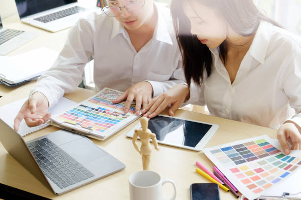 istock team of designers in the workplace. 956878314