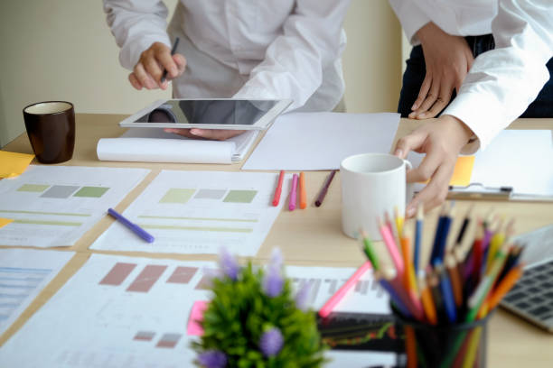 istock team of designers in the workplace. 956878370