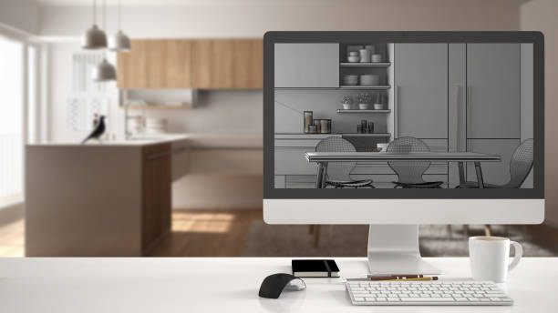 istock Architect house project concept, desktop computer on white work desk showing unfinished CAD sketch or drawing, real finished minimalist white and wooden kitchen interior design in the background 956885848