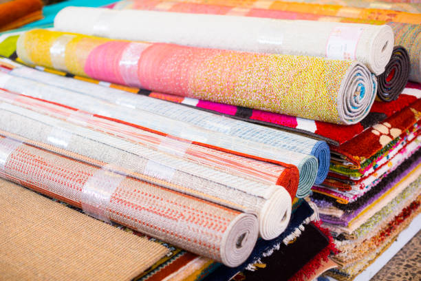 istock Stack of traditional  colorful carpets in carpet shop 956886166