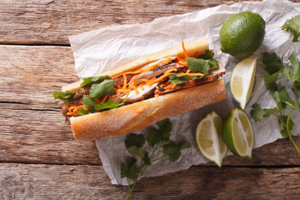 istock Vietnamese sandwich with cilantro and carrot close-up. Horizontal top view 956886836