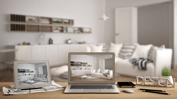 istock Architect designer desktop concept, laptop and tablet on wooden work desk with screen showing interior design project and CAD sketch, blurred draft in the background, white kitchen idea template 956887822