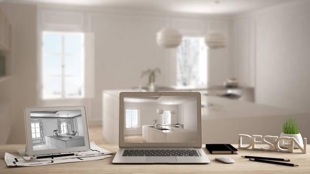 istock Architect designer desktop concept, laptop and tablet on wooden work desk with screen showing interior design project and CAD sketch, blurred draft in the background, bright kitchen idea template 956887898