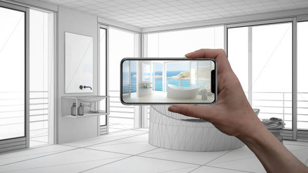 istock Hand holding smart phone, AR application, simulate furniture and interior design products in real home, architect designer concept, sketch project background, modern bathroom 956896348