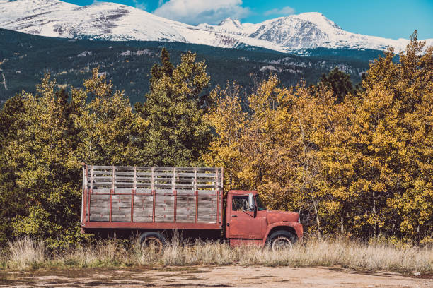 istock Old rusty truck at autumn sunny day 956897180