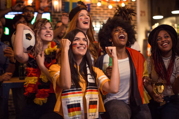 istock Soccer fans cheering 956906614