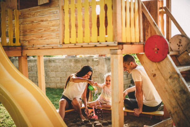 Happy Family at the Playground with Treehouse