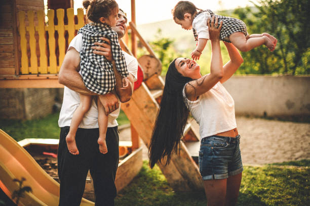 istock Happy family on the playground 956913608