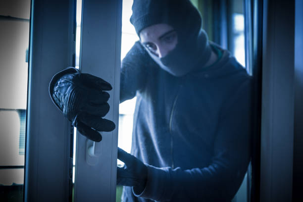 istock Burglar Breaking Into House 956916450
