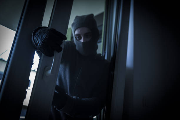 istock Burglar Breaking Into House 956916466