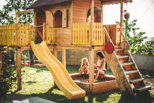 istock Mother and daughter having fun in playground 956919530