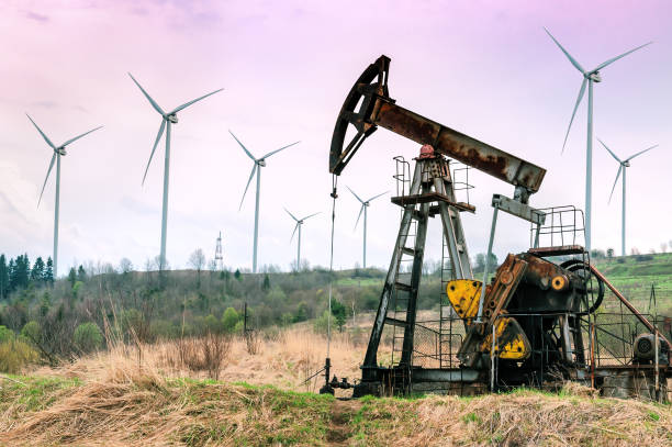 istock windmills and working oil pump 956925382
