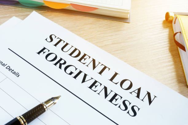 istock Student loan forgiveness form on a desk. 956926278