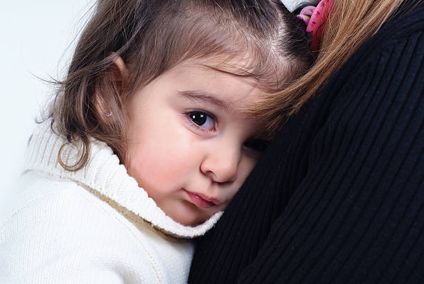 istock little girl in her mother's lap 95692974