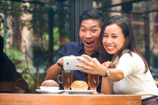 istock Malaysian couple taking selfie together happilly 956931788