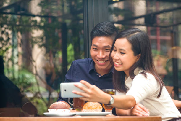 istock Malaysian couple taking selfie together happilly 956931792