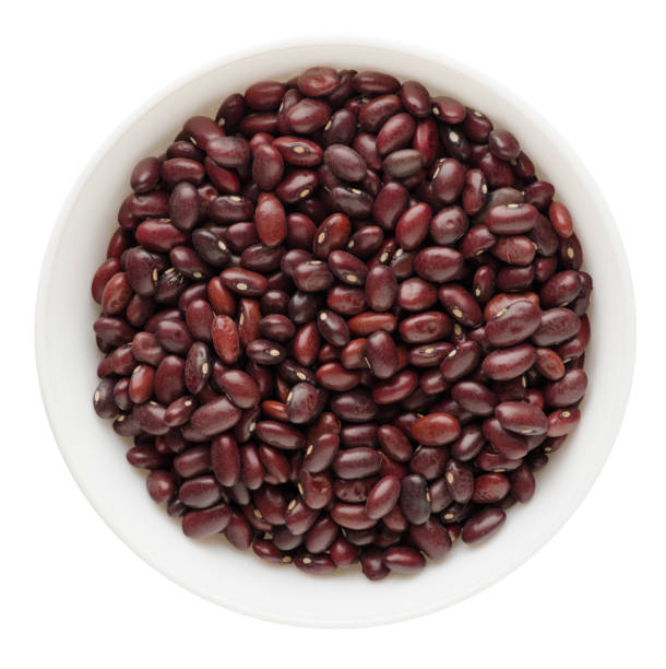 istock red beans in a bowl isolated on white background. red beans top view 956932062
