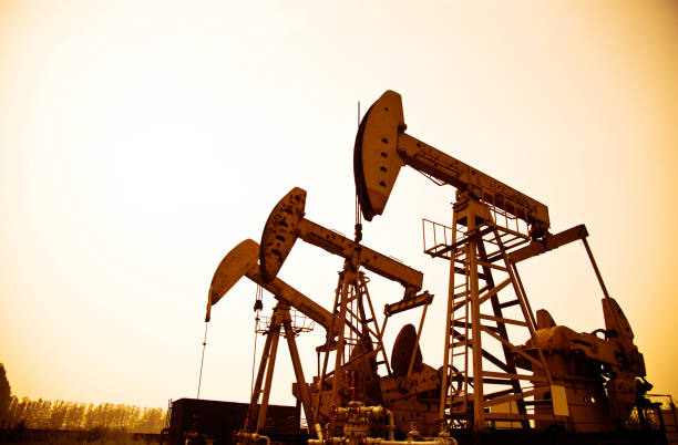 istock Oil pumps working at sunset 956939462