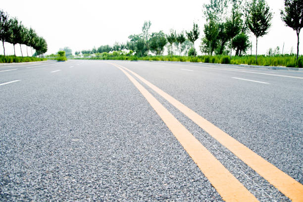 istock Double yellow lines on a road 956940382
