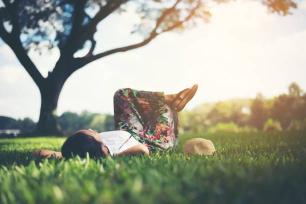 Girl peaking through the leaves