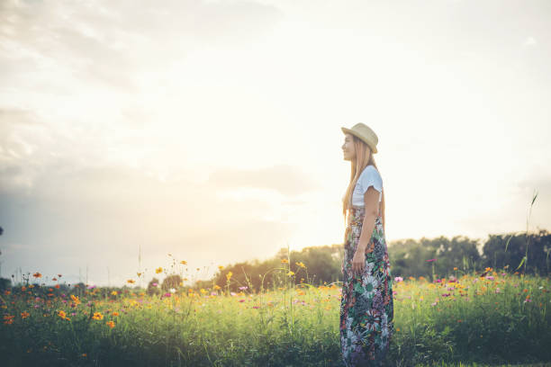 istock Young woman walking in a park, Relax concept 956943974