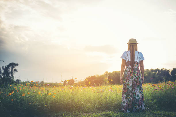 istock Young woman walking in a park, Relax concept 956943986
