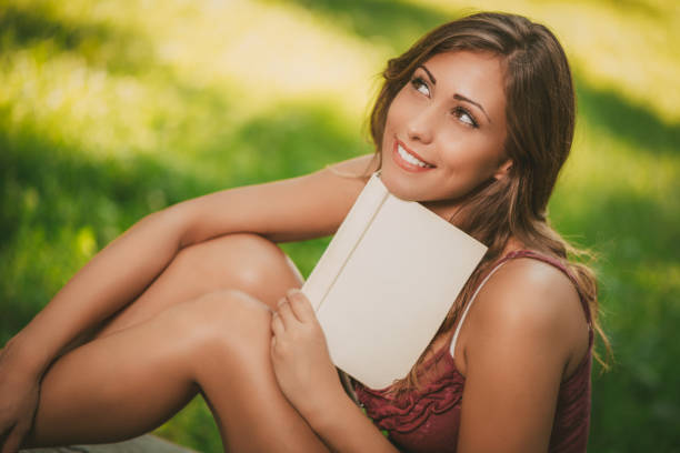 istock Young Woman With Book 956944630