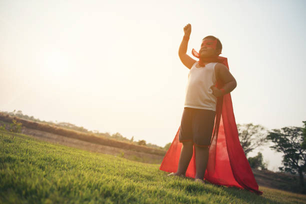 istock Super boy standing show power strong to fly 956945290