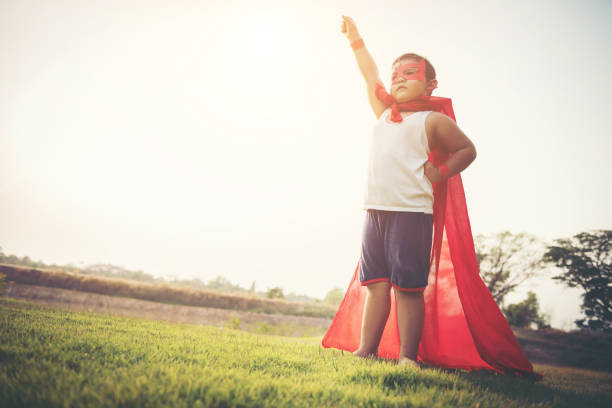 istock Super boy standing show power strong to fly 956945342