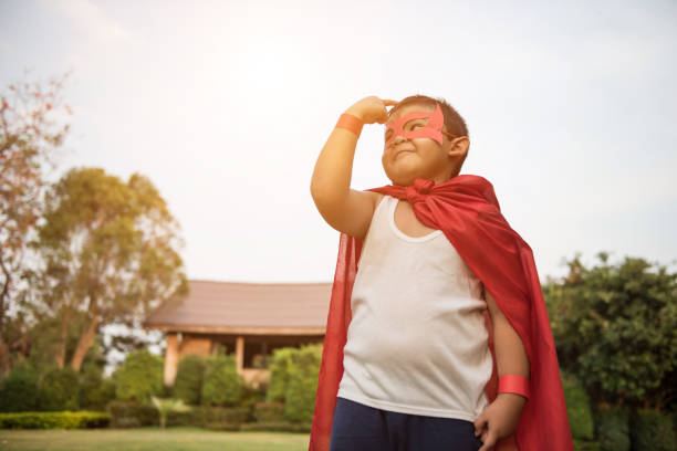 istock Super boy standing show power strong to fly 956945558