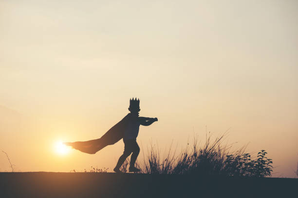 istock Super boy standing show power strong to fly 956945564
