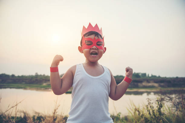 istock Super boy standing show power strong to fly 956945700