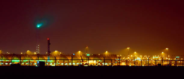 istock night landscape concept from light moving of flight control tower and working activity on ground with night sky background 956946354