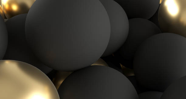 istock Black And Golden Realistic Spheres Close Up.3D Rendering 956951378