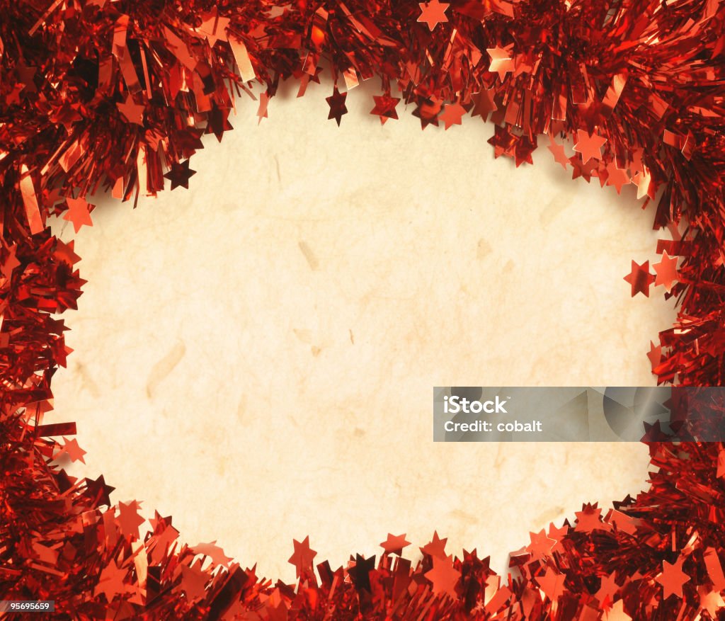 Christmas Background Red Tinsel frame on textured paper Brown Stock Photo