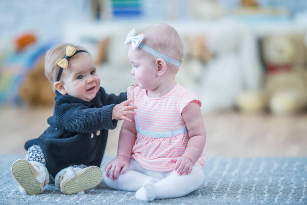 istock Baby sister wants a hug 956960504