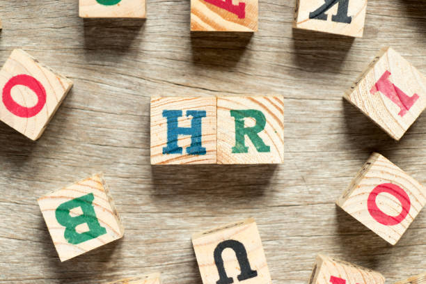 istock Letter block in word HR (Abbreviation of human resource) with another on wood background 956968288