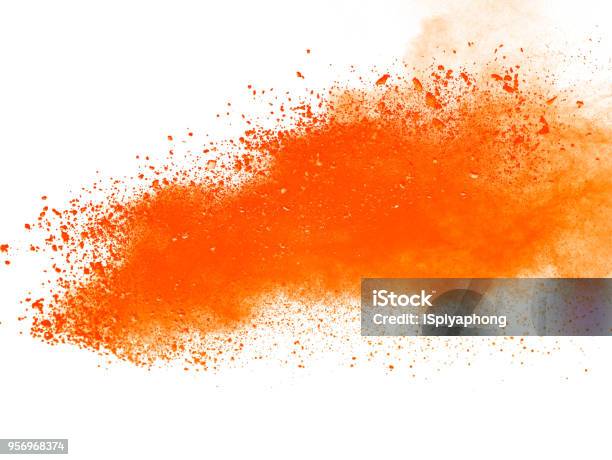 Explosion Of Orange Powder On White Background Stock Photo - Download Image Now - Orange Color, Paint, Spray