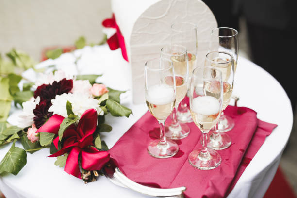 istock Luxury glasses with champagne on the table 956972396