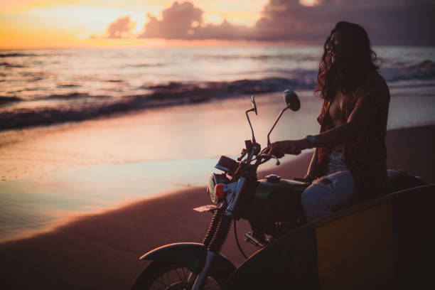 istock Enjoying sunset at the beach 956972750