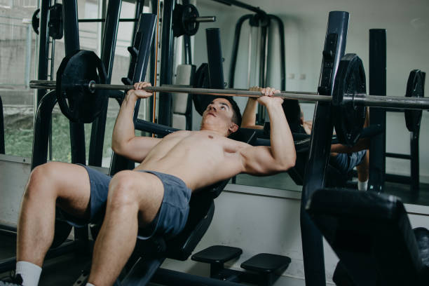istock Building his muscles in the gym 956973062