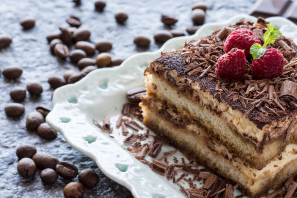 istock Dessert Tiramisu Cake with Grated Chocolate, Raspberry and Mint 956981504