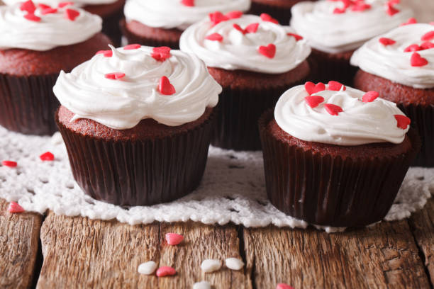 istock red velvet cupcakes decorated with hearts close-up. Horizontal 956981804