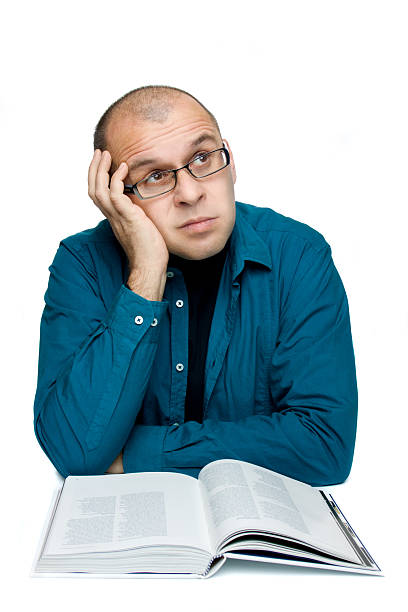 istock Adult man reading a book 95698186