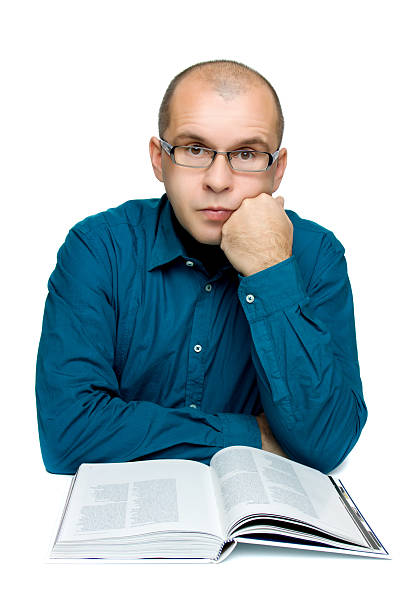 istock Adult man reading a book 95698187