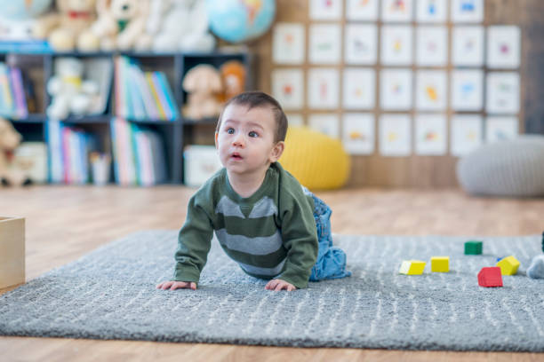 istock Adorable inquisitive baby boy 956982078