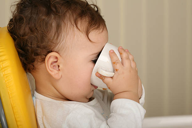 Thirsty toddler stock photo