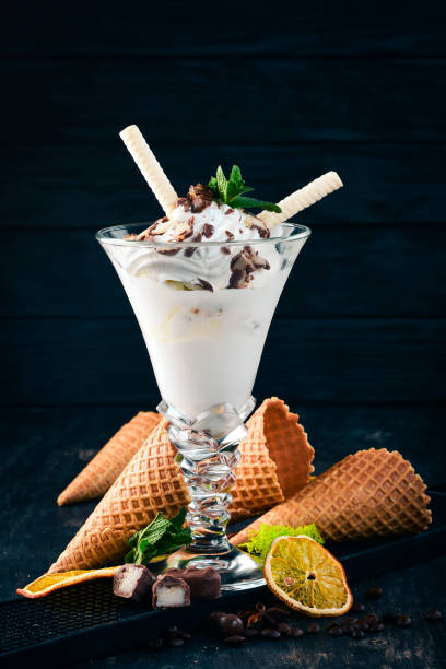 istock Creamy ice cream. On a black wooden background. Copy space. 956993460