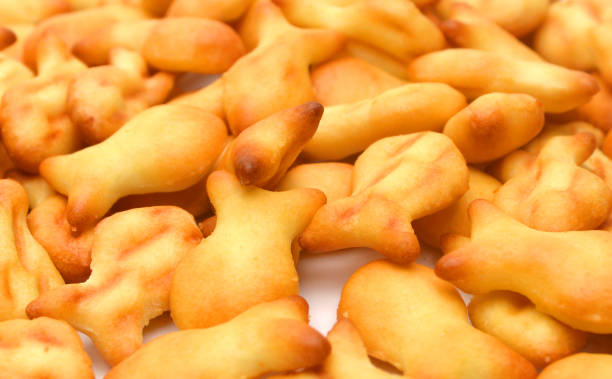 istock Closeup view of fish shaped crackers 956993828